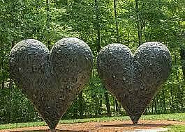 Two stone heart sculptures