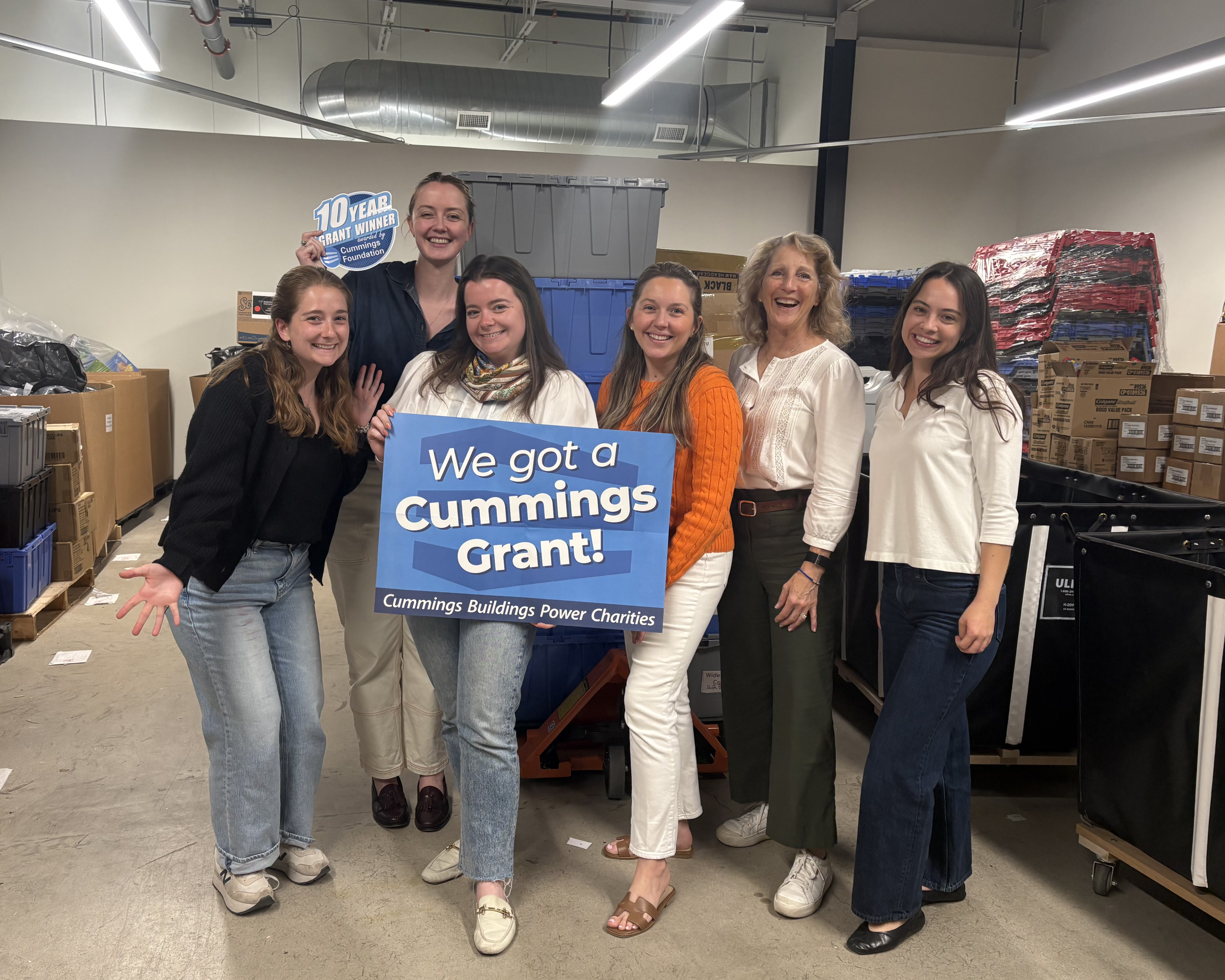 The Wonderfund team celebrating at Wonderfund HQ in Newton, MA. L to R: Anna Hirsch, Molly Doherty, Colleen Walsh, Kaitlin McInnis Spinney, Lauren Baker, Ella Santiago
